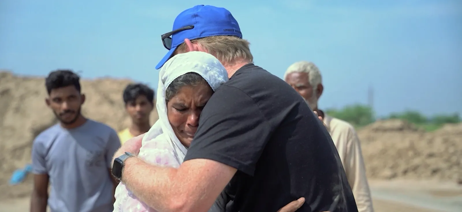 A woman embraces an IFF team member during a family’s release at a brick kiln.